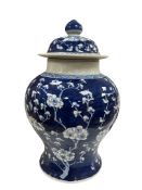 A Chinese blue and white prunus jar and cover, bears six character mark, approx 35cm high.