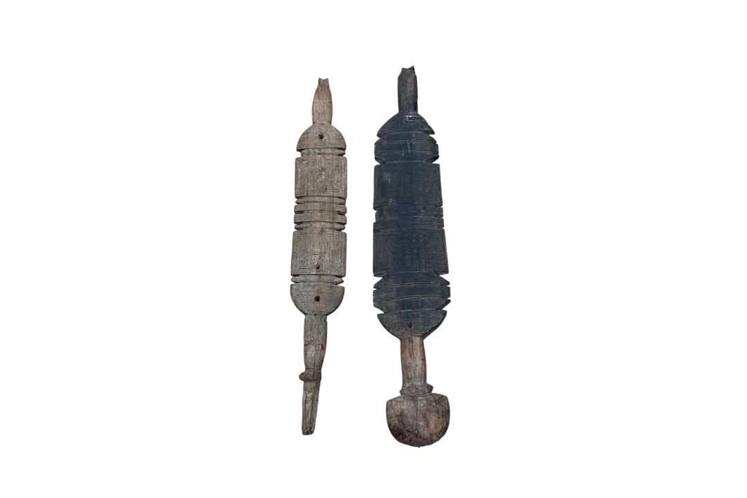Two carved wood Tuareg tent pegs, with geometric carved decoration, longest 75cm - Image 1 of 2