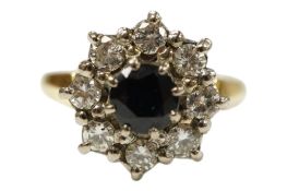 A late 20th century 18ct gold, sapphire and diamond set flower head cluster ring, size N/O, gross
