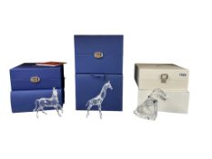 Three Swarovski crystal glass animal figures comprising, a giraffe, dog and horse, each boxed with
