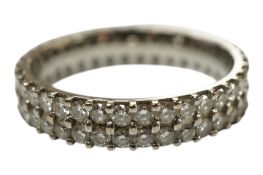 An 18ct white gold and dual band diamond set full eternity ring, size N, gross weight 3.2 grams.