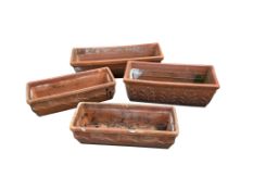 Four rectangular terracotta planters, largest width 62cm, depth 19cm, height 19cm