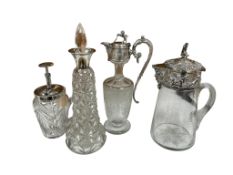 A collection of four silver electroplated jugs to include an Elkington & Co example and an