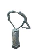 An abstract bronze garden sculpture of dancers, carved stone plinth, width 67cm, depth 25cm,