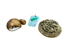 A Chinese jadeite pendant, an archaistic russet stone discovered and a vegetable ivory carving,