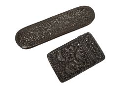 An early 20th century Indian repousse white metal card case, decorated with birds amongst foliage,