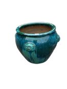 A large glazed earthenware circular garden planter, diameter 54cm, height 48cm