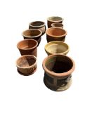 Nine terracotta pots, largest diameter 40cm, height 30cm