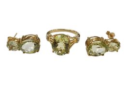 An unusual recent 9ct gold and single stone oval cut sillimanite dress ring, with diamond set