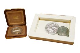 A cased Royal Mint one ounce fine silver £2 pound coin, a USA Liberty dollar coin and a 1986 Seoul