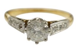 An 18ct, plat and single stone diamond ring, with diamond set shoulders, one stone missing, size I/