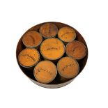 A Victorian or later circular spice box, containing eight labelled spice canisters, diameter 23cm