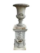A fibreclay campana garden urn on square pedestal, height 170cm