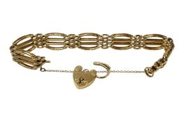 A 9ct gold gate link bracelet, with heart shaped padlock clasp, approx. 16cm, 26.4 grams.