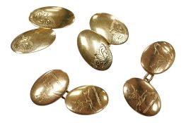 A pair of 10ct oval cufflinks, engraved with a family crest, 7.5 grams, together with a pair of