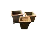 Three square terracotta planters, largest width 34cm, height 28cm
