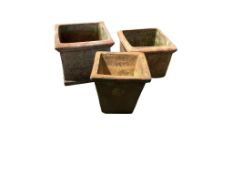 Three square terracotta planters, largest width 34cm, height 28cm