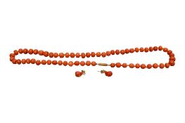 A single strand coral bead necklace, with a yellow metal barrel clasp, 50cm and pair of pear-