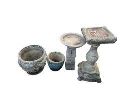 Two reconstituted stone garden bird baths, larger height 80cm, a metal bird bath, diameter 46cm,