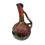 An early 20th century Elton ware ‘sunflower’, ewer, 38cm high