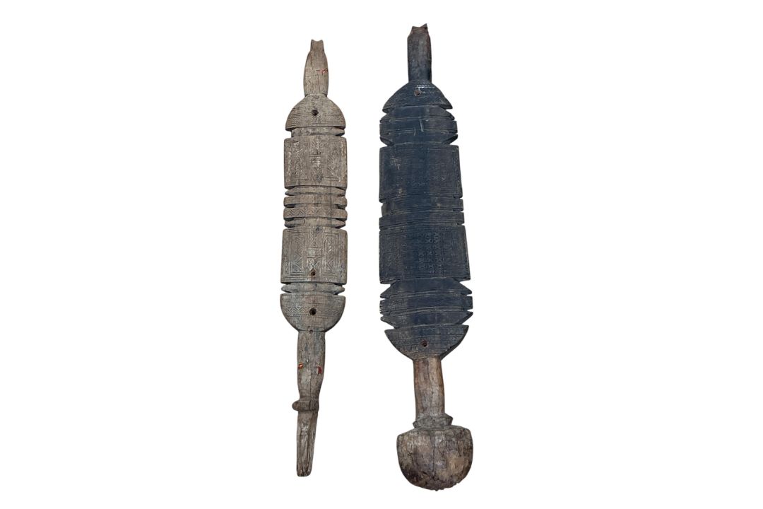 Two carved wood Tuareg tent pegs, with geometric carved decoration, longest 75cm - Image 2 of 2