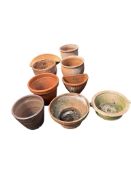 Nine terracotta planters, largest diameter 32cm, height 25cm