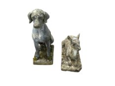 A reconstituted stone garden ornament of a seated hound, height 74cm together with one other