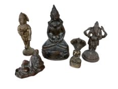 A collection of Asian bronze and metal figures, comprising a seated Bodhisattva, a standing Ganesha