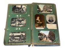 Postcards - in 2 old cloth albums, mostly Britain and pre-war (some late 19th cent.); topographical,