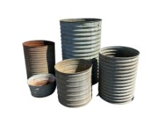 Five 1950’s galvanised agricultural water tanks, largest diameter 78cm, height 117cm