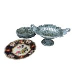 A Victorian part dessert service, comprising a pierced basket and six plates, printed in green