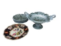 A Victorian part dessert service, comprising a pierced basket and six plates, printed in green