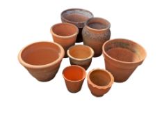 Eight terracotta pots, largest diameter 44cm, height 35cm