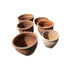Six terracotta pots, largest width 43cm, height 36cm