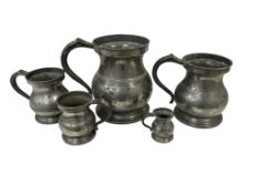 A set of five graduated Victorian pewter measures, stamped to rims, tallest 15cm. (5)