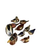 A collection of Royal Crown Derby paperweights, comprising a penguin, a mallard duck and various