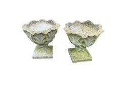A pair of circular reconstituted stone garden planters of leaf form, diameter 43cm, height 41cm