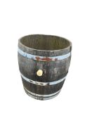 A French three quarter cut wine barrel, diameter 64cm, height 70cm