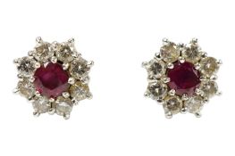 A pair of 18ct white gold, ruby and diamond set flower head cluster ear studs, diameter approx.
