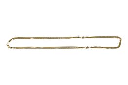 A 750 yellow metal multi strand necklace, approx. 34.5cm, 31.6 grams.