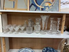 A collection of Victorian cut glassware to include a pair of candlesticks, a jug, various glasses