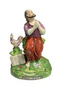 An early 19th century pearlware figure of St Peter, 19cm high