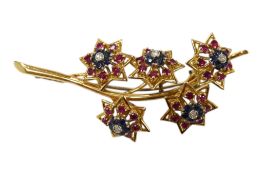 A mid 20th century unmarked yellow metal, ruby, sapphire and diamond cluster set floral spray