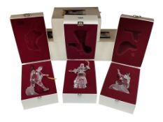 Three Swarovski crystal glass figures comprising Pierrot, Masquerade Columbine and Harlequin, each