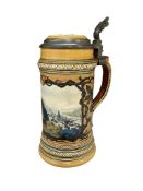 A 19th century stoneware stein, painted with a view of Heidelberg, with hinged pewter cover,