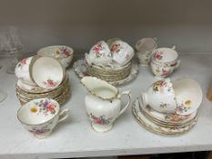 A Royal Crown Derby porcelain part tea set decorated with flowers, to include milk jug, sugar