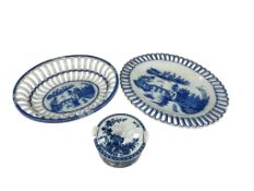 A Leeds ware blue and white pierced chestnut basket and stand, together with a Caughley butter dish.