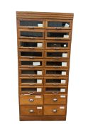 A mid 20th century oak haberdashery unit of twenty drawers, width 91cm, depth 48cm, height 199cm