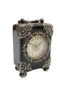 An early 20th century white metal mounted tortoiseshell miniature carriage timepiece, with Arabic
