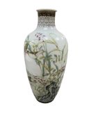 A Chinese famille rose bottle vase decorated with birds and flowers, 20cm high